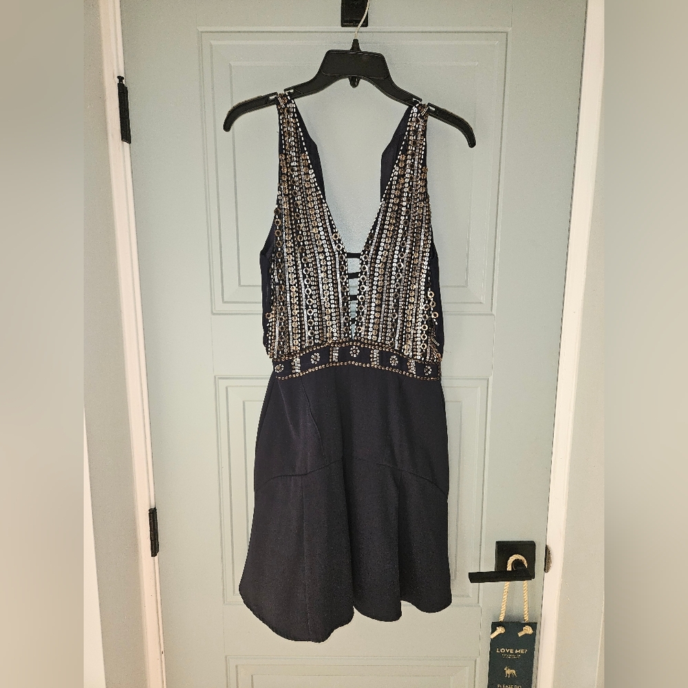Black Sleeveless Dress with Silver Embellishments